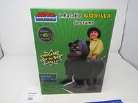 Box packaging showing the inflatable gorilla costume brand Airborn Inflatable, with a picture of wearer on gorilla costume, advertises inflates in 45 seconds and tail up to 5 feet.