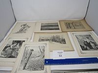 Seven vintage black and white etching prints laid out on a flat surface with ruler for scale, showing varied subject matter including people and landscapes.