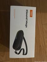 Front of the Tribit XSound Mega speaker packaging showing the product image and branding.