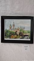 Full view of framed watercolor showing Ottawa Canal and buildings under cloudy sky.