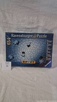 Front view of the Ravensburger Krypt puzzle box showing the overall design and 654 piece count.