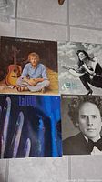 Four LP records shown: Gordon Lightfoot, Lisa Lisa, LaTour, Art Garfunkel covers visible.