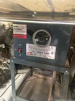 Front view of the 10 inch Delta table saw with visible control panel and angle gauge.