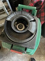 Close-up showing top of Kodak Carousel 760H projector with 35mm slide carousel loaded with slides numbered around the edge.