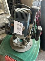 Top view of Freud half inch router showing vents, power cord wrapped around, and handle grips