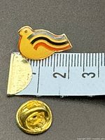 Front view showing dove enamel colours and size reference