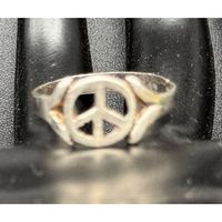 Front view of sterling silver ring showing peace symbol design