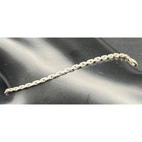 Full bracelet laid out on black surface