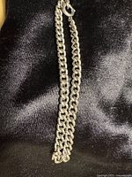 Full view of entire curb link bracelet showing clasp and length