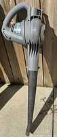 Full view of Yardworks electric leaf blower showing grey body and black nozzle
