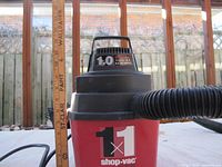 Front view of the 1x1 Shop Vac showing the brand and model details.