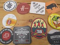 Photo showing a selection of various Ontario microbrewery beer coasters with multiple distinct brewery logos and designs.