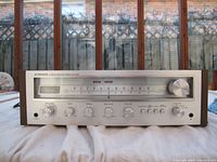 Front view showing silver faceplate, horizontal tuning dial and chrome control knobs