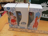 Two boxed Stella Artois commemorative beer glasses featuring Tanzania and Philippines limited edition packaging.