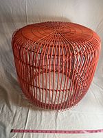 Full view of round wire basket outdoor table showing vertical and horizontal wire frame structure.