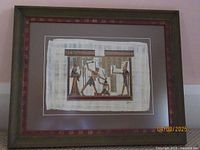 Full framed Egyptian papyrus artwork showing a punishment scene with four figures in traditional attire and hieroglyphs.