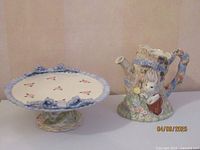 Overall view of the Bunny Hollow ceramic pitcher and cake stand set showing size and design
