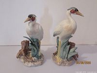 Pair of vintage Fitz & Floyd marsh egret bird figurines on white background, showing front view with both figurines side by side.