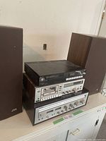 Full view of stacked stereo components and speakers