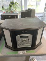 Front view of the wooden hexagonal Memorex stereo system showing front control panel and side speakers