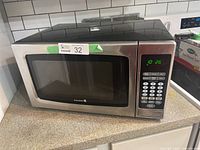 Front view of Kuraidori microwave for sale showing full unit and label with lot information.