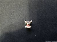 Front view of the Pandora sterling silver Canadian moose charm wearing a red sweater.