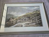 The entire framed artwork showing seven wolves in a mountainous setting, with the frame and mat.