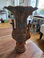 Full frontal view of the vintage copper vase with double peacock design and green-blue patina.