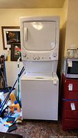 Front view of white stacked washer and dryer unit