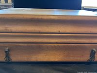 Closed wooden flatware chest front view