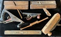 Overview of all seven antique woodworking tools