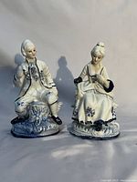 front view of both porcelain figurines