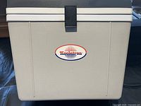 Front of travel cooler showing logo and latch