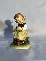 Front angle of Busy Student figurine