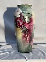 Full view of signed porcelain vase with floral painting