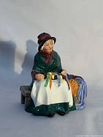 Front view showing figurine details and ribbons