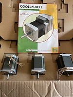 Three servo motors and Cool Muscle leaflet in original packaging
