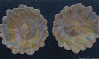 Top view of both amber iridescent sunflower glass bowls