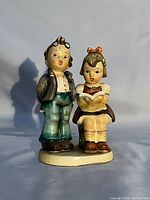 Front view of Napco Tutoring figurine showing both children