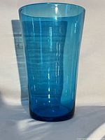 Full frontal view of blue glass vase