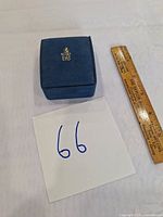 Closed Birks box with ruler and lot number card visible