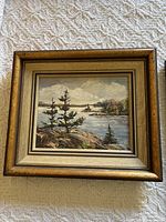 Image of 15x13 Georgian Bay landscape oil painting in wood and beige layered frame with textured brushwork on canvas.