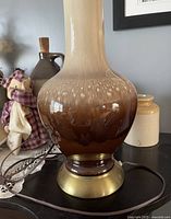 Close-up of the ceramic lamp base showing the brown gradient glaze and textured finish.