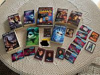 Top-down view of Star Trek Deep Space Nine novels and vintage Star Trek collector cards arranged on a tablecloth.