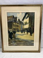 Framed print showing full artwork with street scene of people and buildings in daylight.