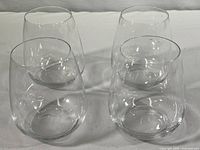 Photo showing four clear Luigi Bormioli glasses arranged in a group, displaying the shape and size of each glass.