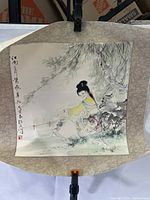 Full view of the Chinese scroll print showing a woman under a tree with calligraphy and artist seals.