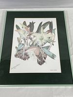 Full shot of the framed botanical print showing Brassavola digbyana orchid with green mat and silver frame.