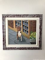 Full view of the painting showing dog sitting on patio with brick wall background and flowers to the side.