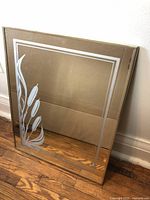 Full view of the vintage rectangular mirror featuring an etched bullrush design and double-lined border.